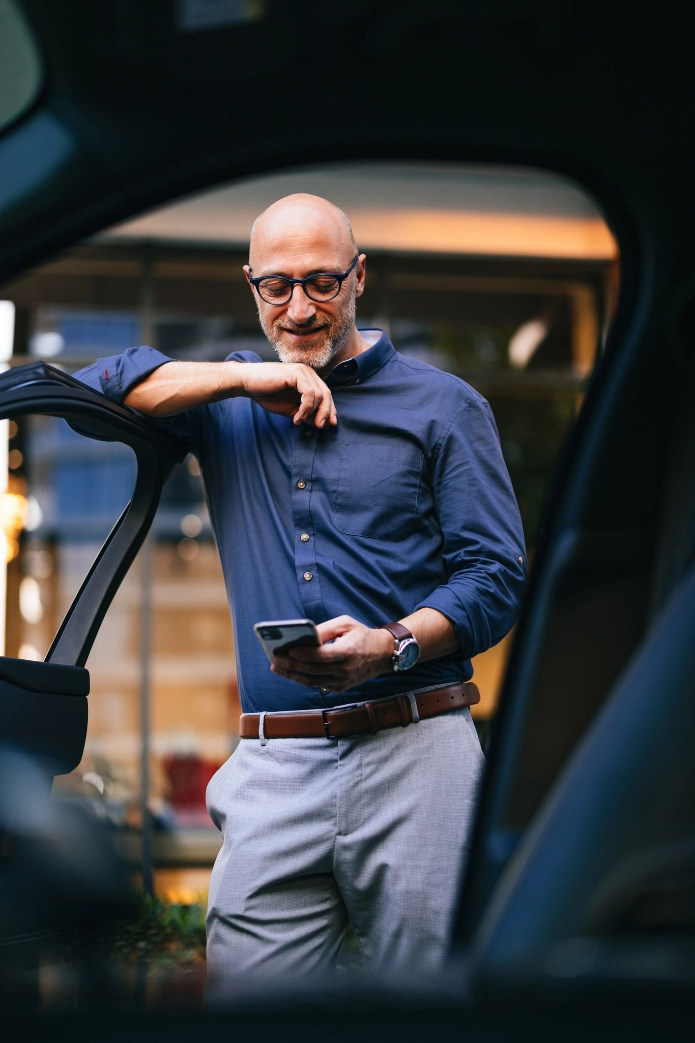 Professional chauffeur preparing for a corporate car service in Melbourne